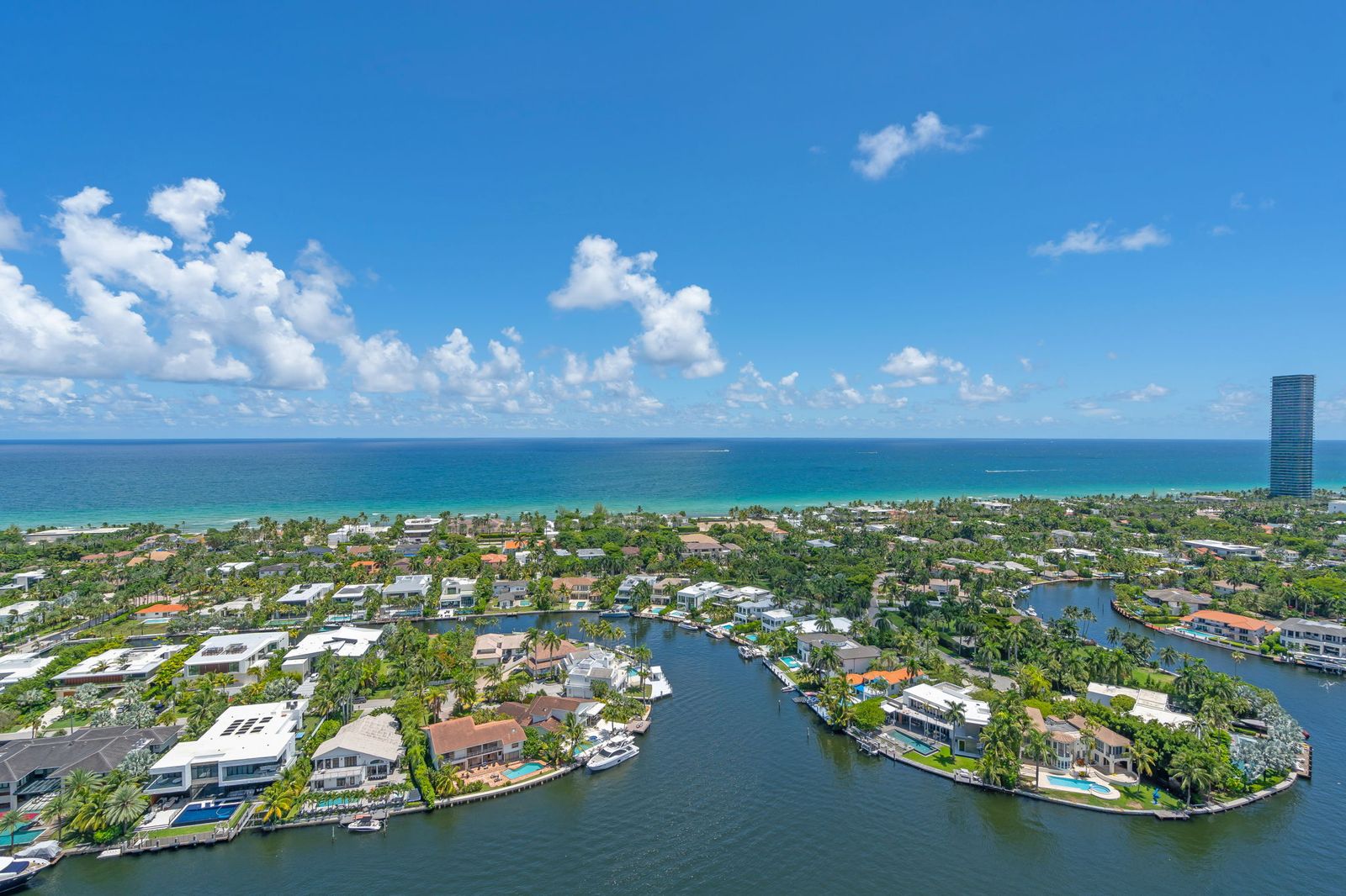 Aerial view over waterfront estates to the Atlantic
