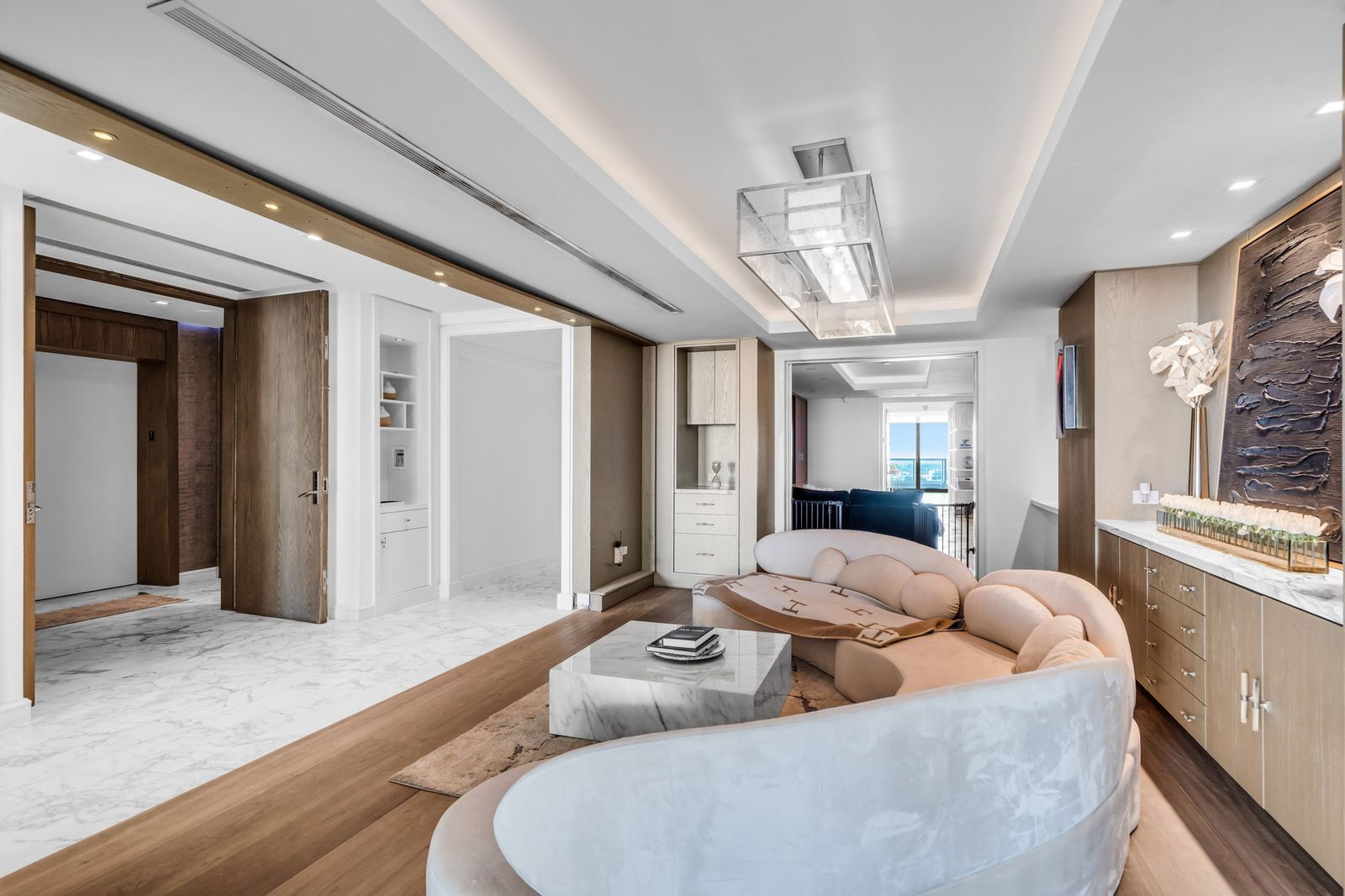 Family den with sculptural seating and designer ceiling