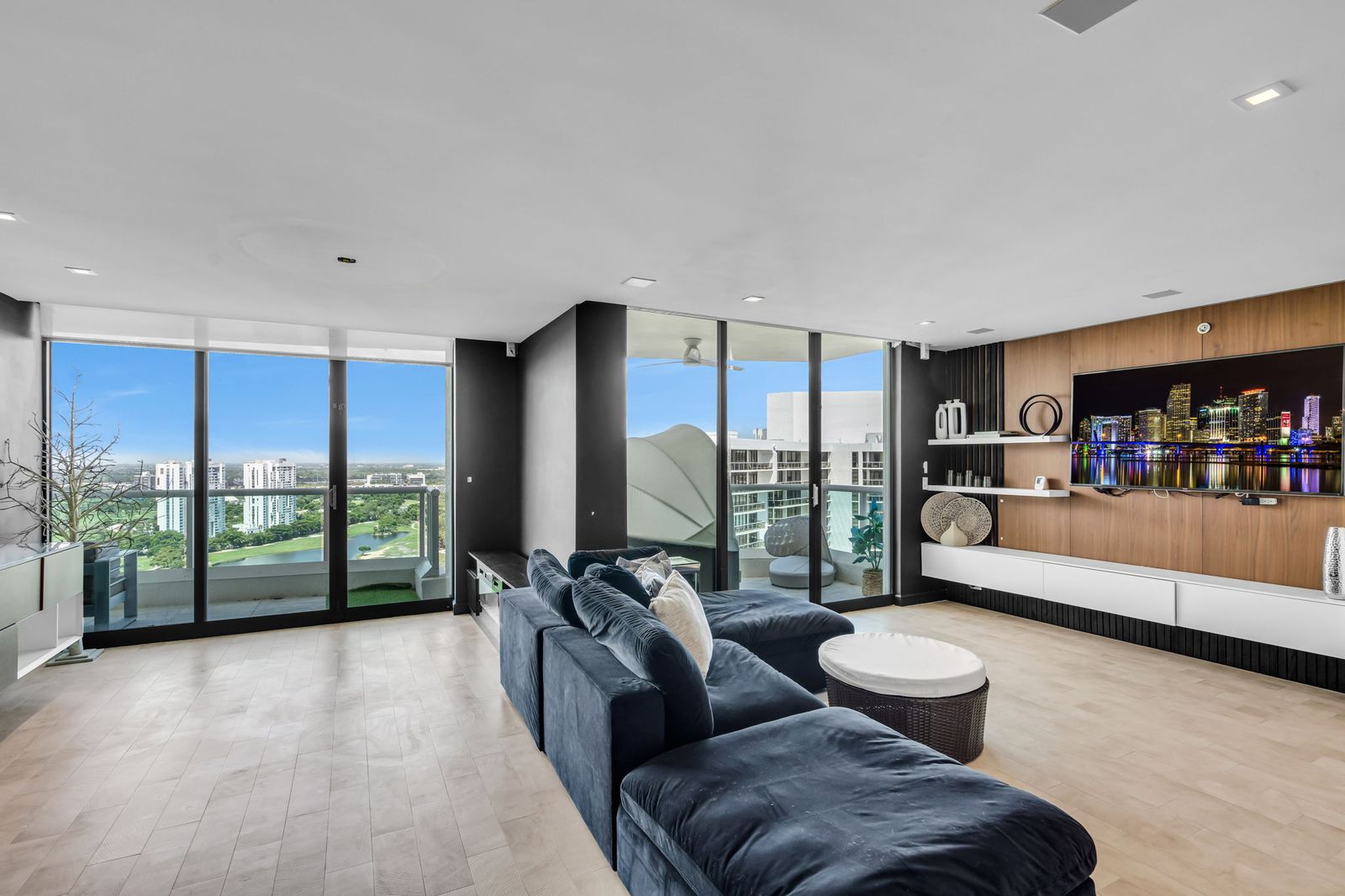 Media den opening to the terrace with golf course views
