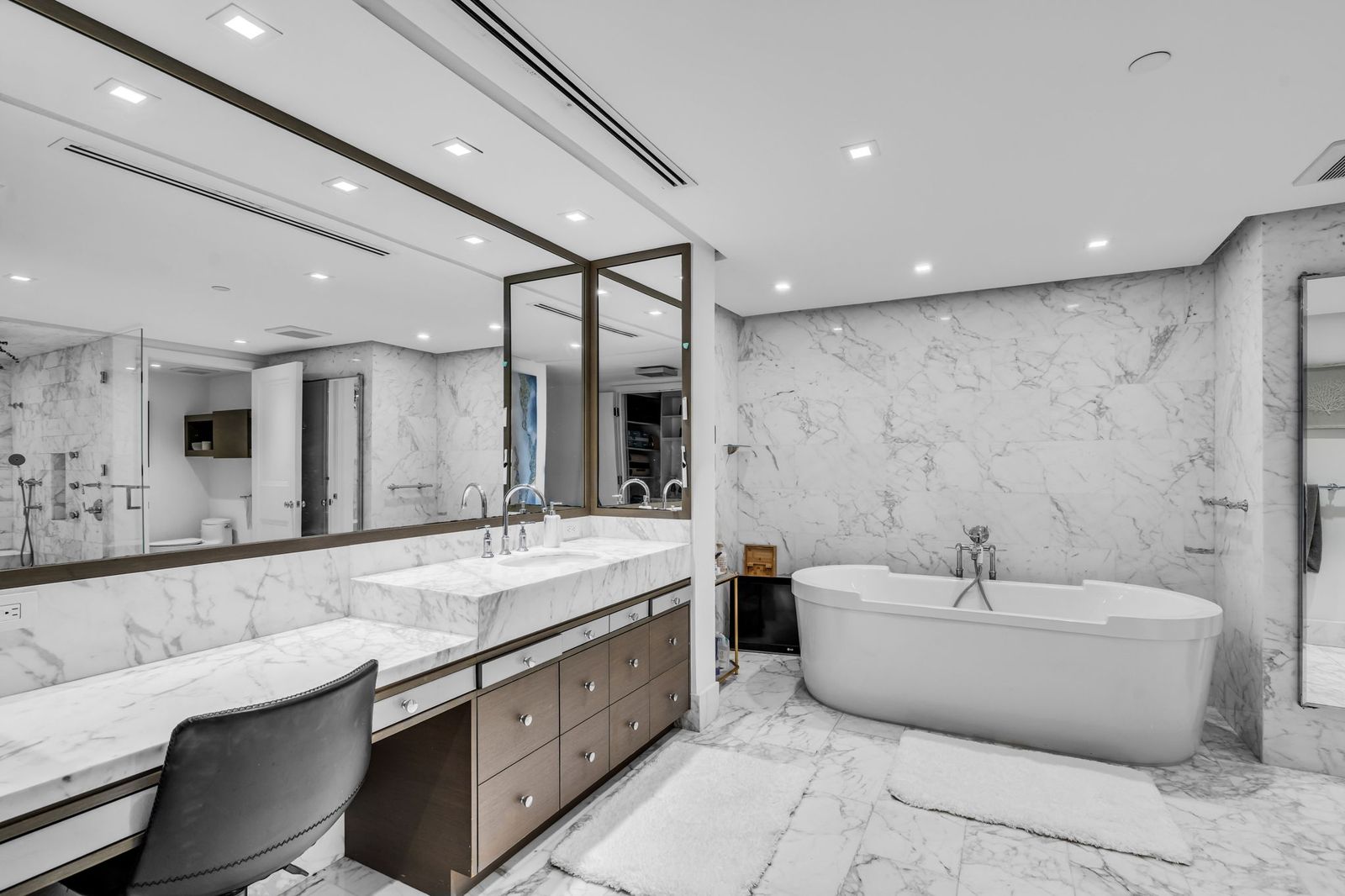 Spa bath with freestanding tub and marble